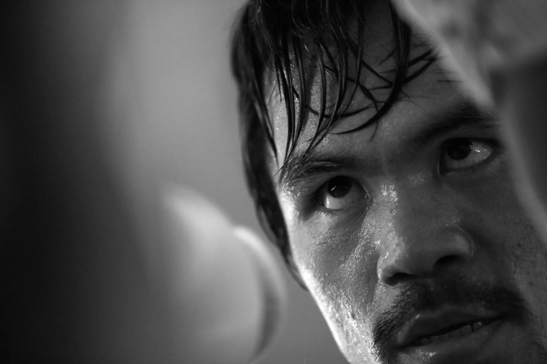 Manny Pacquiao, sweat-soaked, in tight close-up mid-training